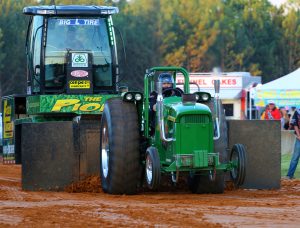 John Deere pulling Pioneer Seed Sled