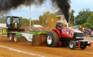 Case International Harvester tractor pulling Pioneer Seed Sled