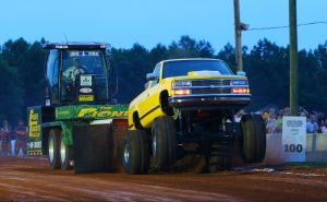 Chevrolet truck pulling Pioneer Seed Sled